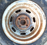 1973–81 Toyota Celica Corolla 14x5.5 OE Steel Wheel Rim With Studded Winter Tire